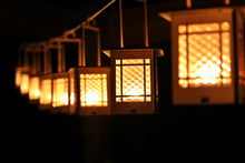 Load image into Gallery viewer, Craftsman Bungalow Luminaires. Lanterns give off warm light while hanging or on a table.