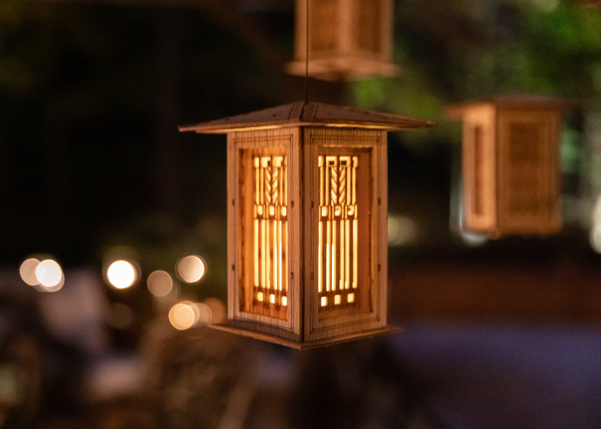 hanging Prairie style lantern creating warm ambient lighting at dusk