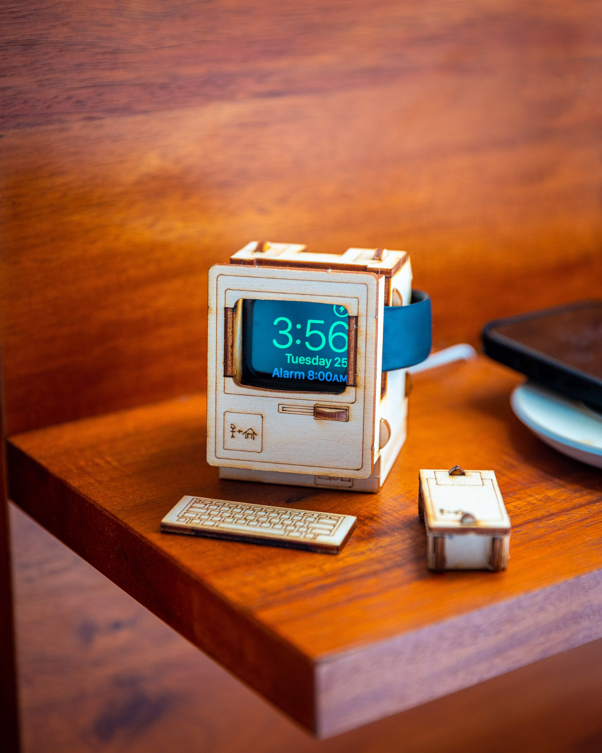 wooden Apple Watch dock inspired by classic vintage computer design displayed on nightstand