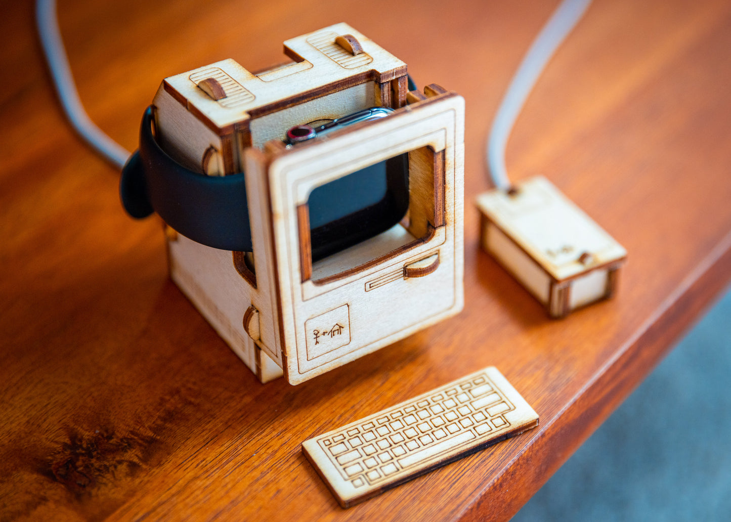 angled top view of retro computer Apple Watch dock showing magnetic charger placement and watch connection