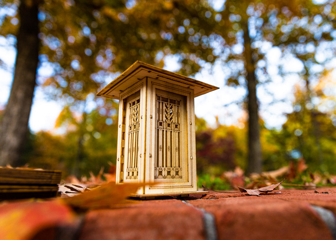 Prairie style luminary featuring geometric architectural panels and layered roof design