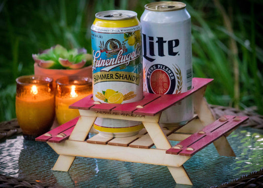 mini picnic table drink holder holding beverage cans and candles as outdoor tabletop centerpiece