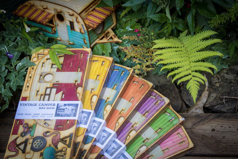 multiple color variations of camper birdhouse kits displayed in fan arrangement