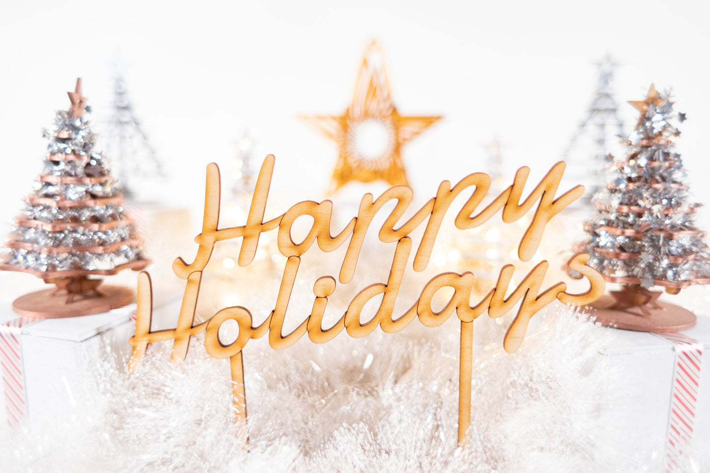 wooden Happy Holidays tabletop sign with glowing star accent and winter holiday decor