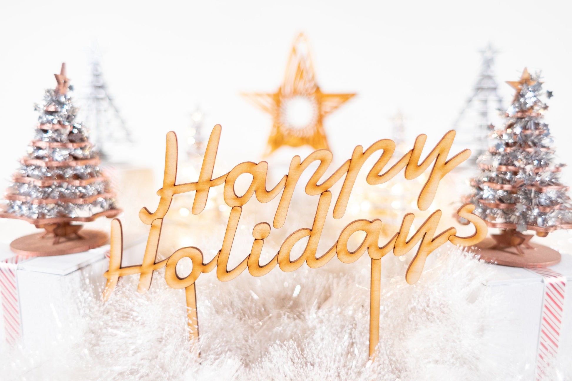 wooden Happy Holidays tabletop sign with glowing star accent and winter holiday decor