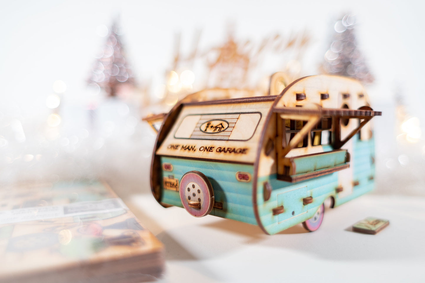 retro camper birdhouse model with pastel blue paint finish shown in minimal studio setting