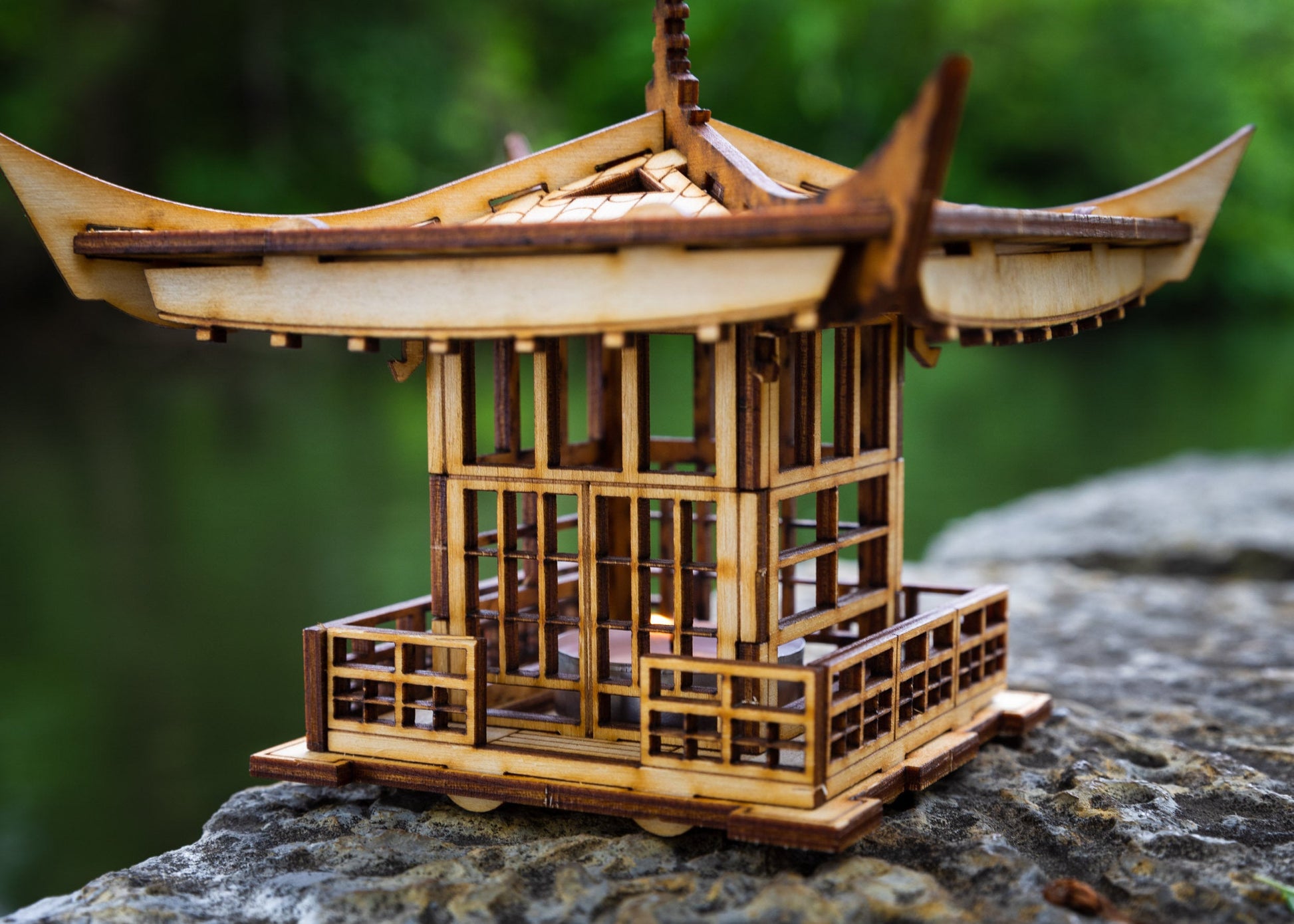 Angled view of Japanese lantern highlighting layered roof and detailed wood construction
