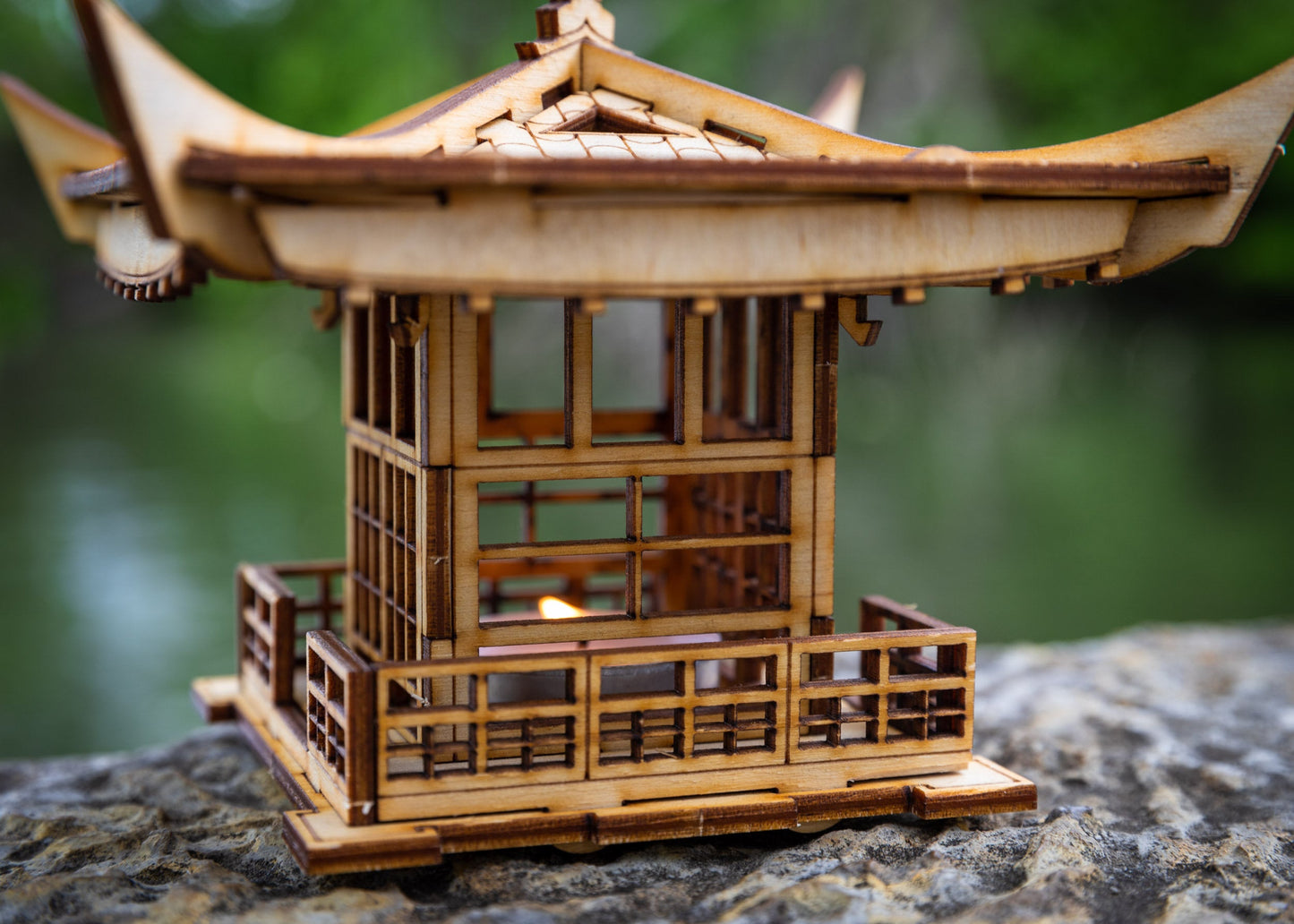 Close-up of LED tea light lantern walls and window details with precision laser-cut wood panels