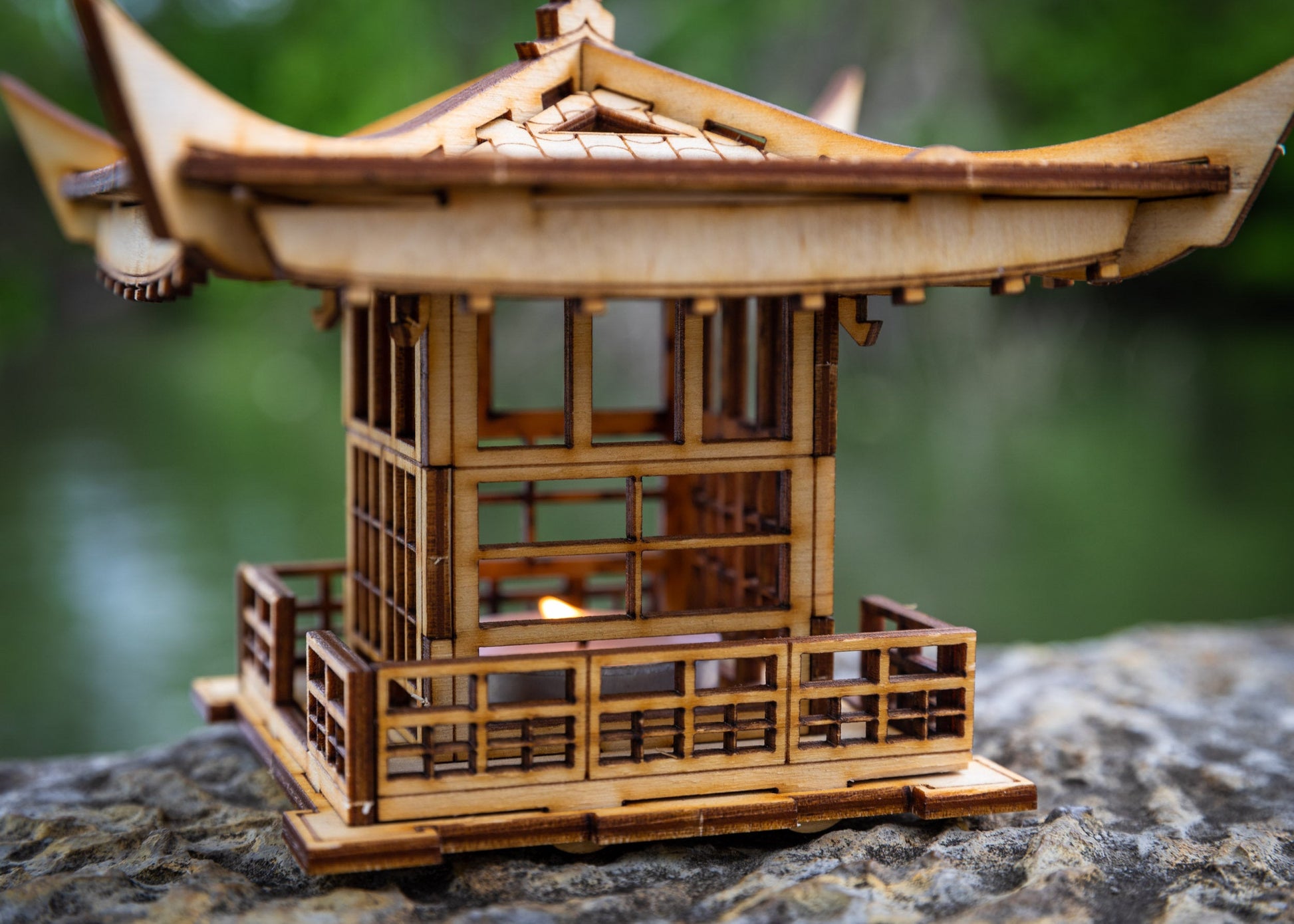 Close-up of LED tea light lantern walls and window details with precision laser-cut wood panels
