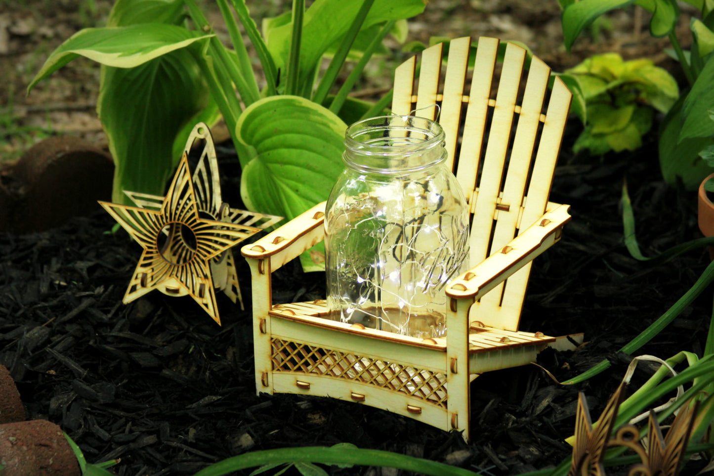 star-shaped hanging lantern displayed outdoors beside miniature Adirondack chair decor